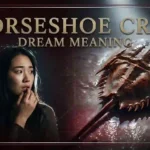 East Asian woman in unsettled fascination beside a massive rust-bronze horseshoe crab capturing horseshoe crab dream meaning.
